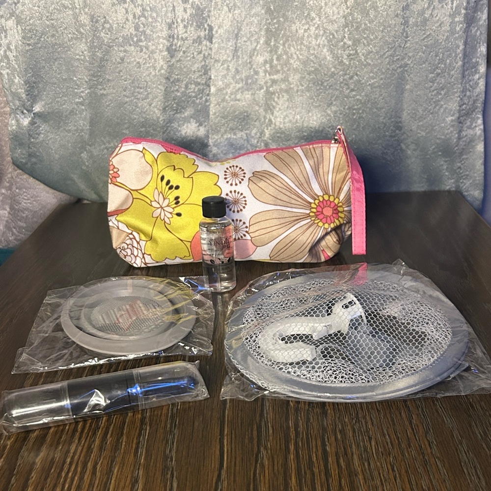 Clinique floral print cosmetic Bag with accessories